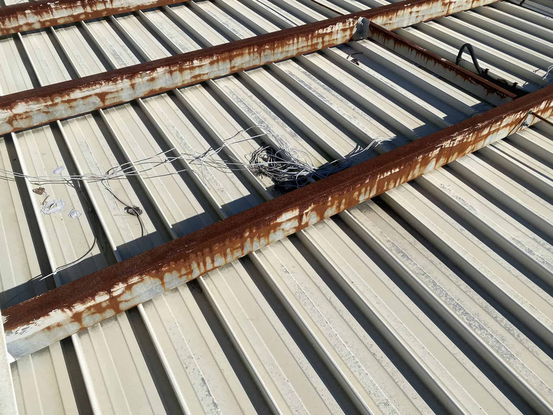 Rusted beams in roof canopy