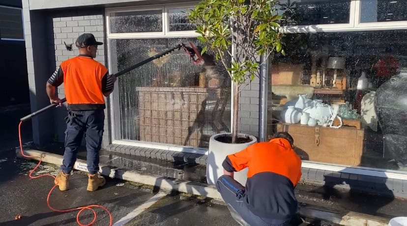 Workers cleaning the windows of a building