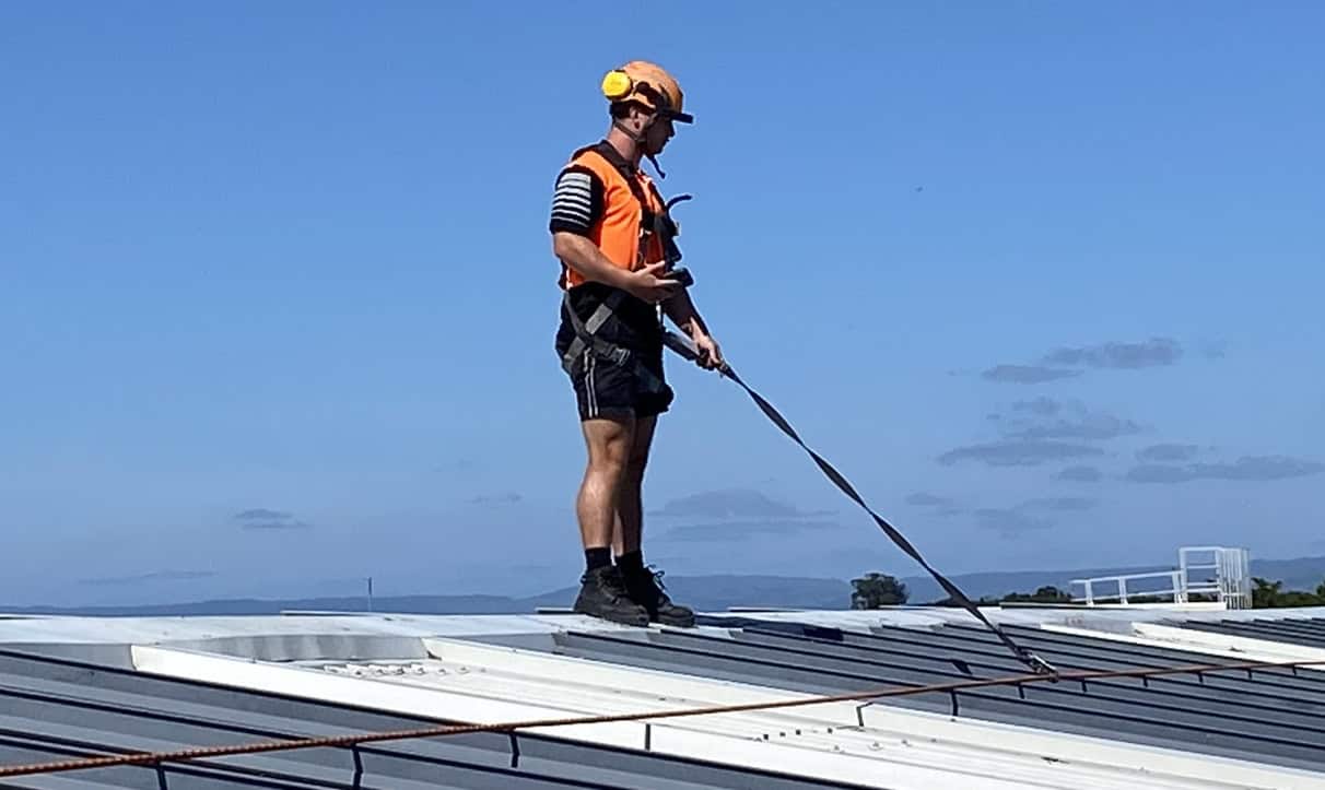 Worker standing on a roof